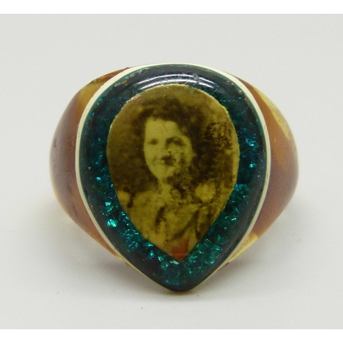 A celluloid prison ring with sweetheart photograph and with blue/green ...