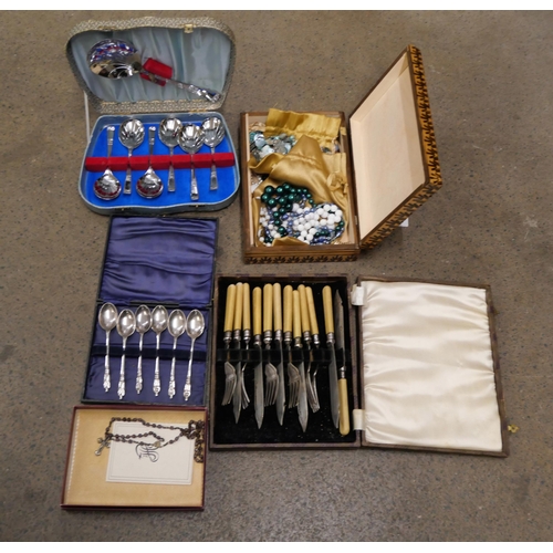 1128 - A box of costume jewellery, rosary beads and three boxes of plated cutlery **PLEASE NOTE THIS LOT IS... 