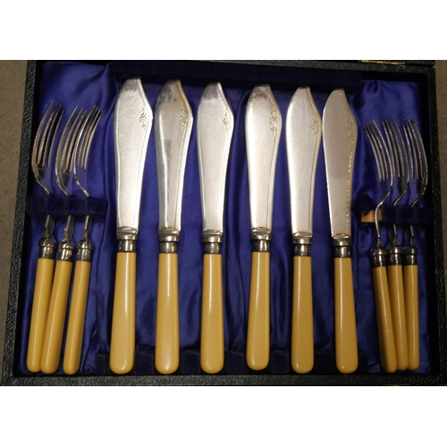 1133 - A cased set of steak knives and forks, fish knives and forks, a plated chocolate pot, plated cup, tw... 