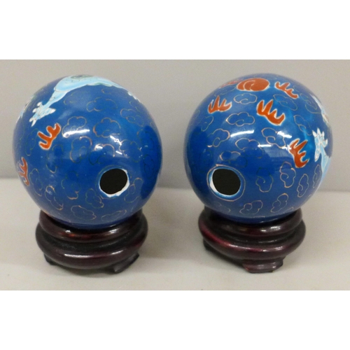 631 - A pair of Chinese eggs on stands