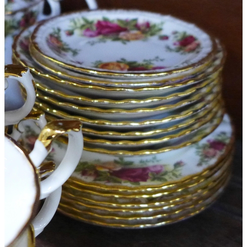 672 - A Royal Albert Old Country Roses tea set, seven cups and saucers, six tea plates, teapot, two creams... 