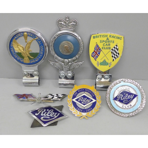 680 - A collection of seven car badges, Riley x3, Royal Aeronautical Society, British Racing and Sports Ca... 