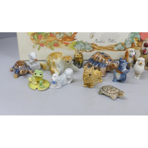 689 - A collection of Wade Whimsies and other Wade figures and a Wedgwood Peter Rabbit nursery set, boxed,... 