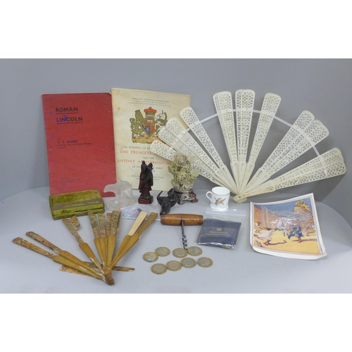 691 - Two fans, a/f, carved wooden figures, coins, Royal Wedding souvenir programme, 1960, carved soapston... 