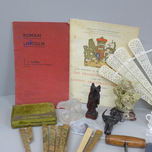 691 - Two fans, a/f, carved wooden figures, coins, Royal Wedding souvenir programme, 1960, carved soapston... 