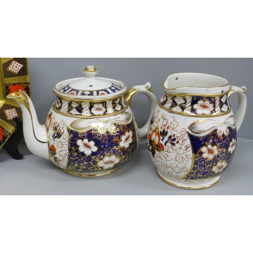 698 - A Royal Crown Derby octagonal 1128 Imari plate, second, a Crown Derby cup and saucer and an Imari ju... 