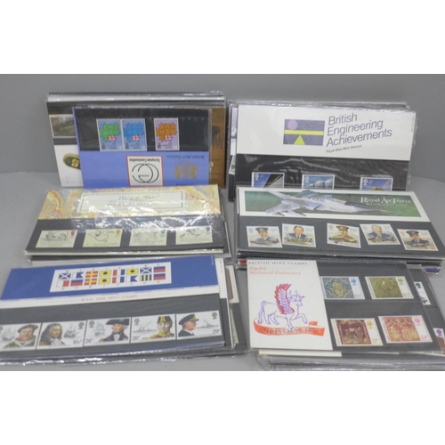 705 - A box of eighty Royal Mail stamp presentation packs