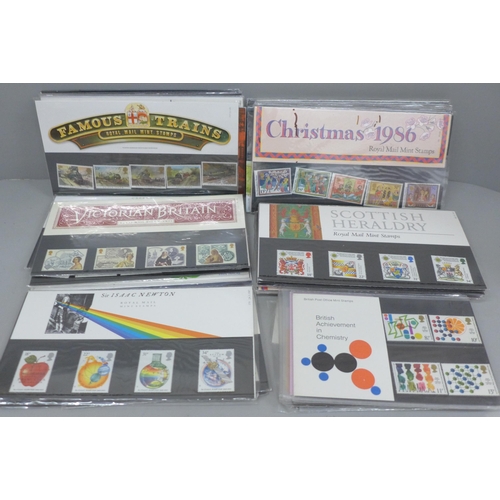 705 - A box of eighty Royal Mail stamp presentation packs