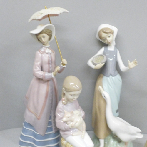 712 - Six Lladro figures, matt finish figure with chip to petals of flowers