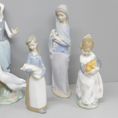 712 - Six Lladro figures, matt finish figure with chip to petals of flowers