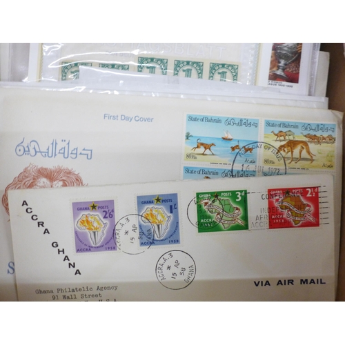 713 - Stamps; a box of stamps, covers, etc.