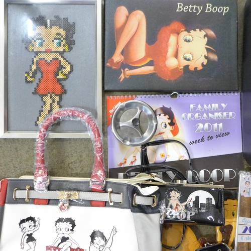 723 - A box of Betty Boop collectables including two bags, ashtrays, boxing gloves, shower gel, seven plas... 