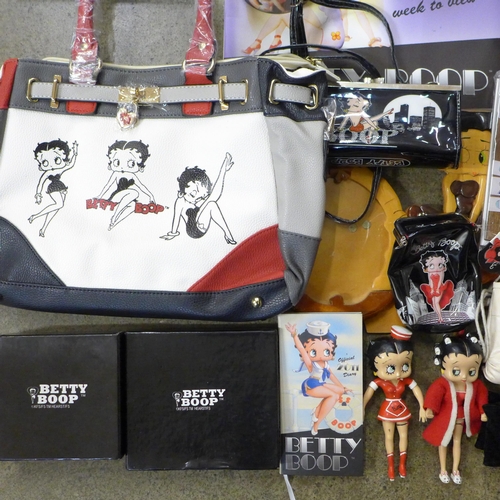 723 - A box of Betty Boop collectables including two bags, ashtrays, boxing gloves, shower gel, seven plas... 