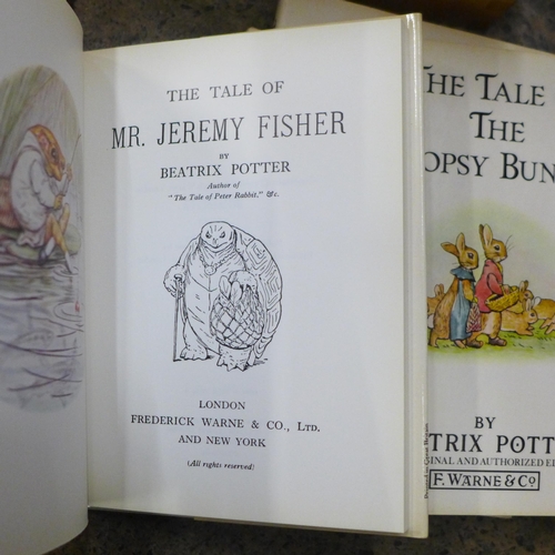 728 - A collection of twenty-three Beatrix Potter Peter Rabbit books, Enid Blyton, etc.