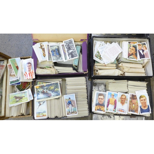 740 - A box of unsorted cigarette cards