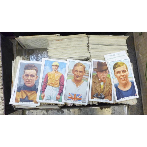 740 - A box of unsorted cigarette cards