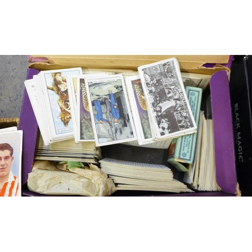 740 - A box of unsorted cigarette cards