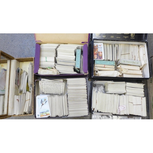 740 - A box of unsorted cigarette cards