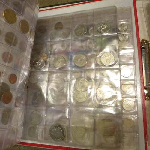 760 - Eight folders of worldwide coins