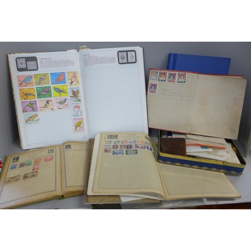 768 - A collection of seven childhood stamp albums and loose stamps