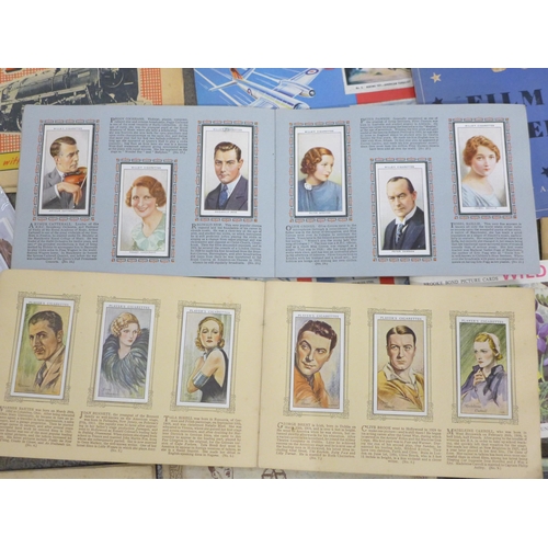 785 - Cigarette cards; a box of cigarette and trade cards in albums and sheets