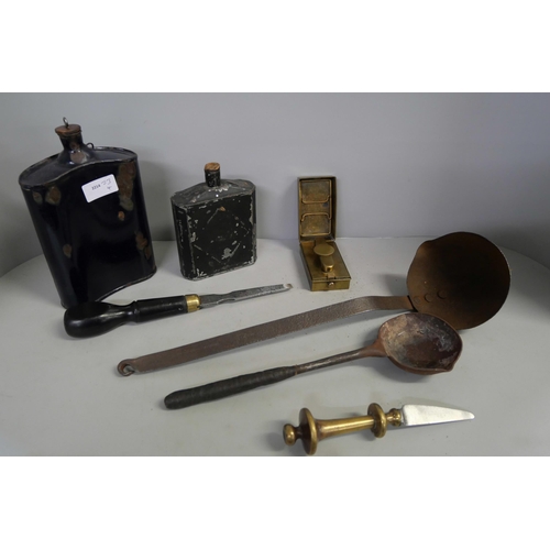 796 - Two powder flasks including one enamelled, two melting pot ladles, a blade marked Rodgers, Sheffield... 