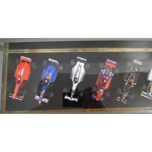 797 - A cased set of ten model Formula 1 racing cars, 1:43 scale