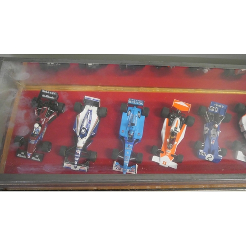 798 - A cased set of ten model Formula 1 racing cars, 1:43 scale