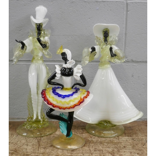 819 - A pair of 1950s Murano glass figures of Calypso dancers, 43cm tallest and one similar smaller figure