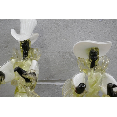 819 - A pair of 1950s Murano glass figures of Calypso dancers, 43cm tallest and one similar smaller figure