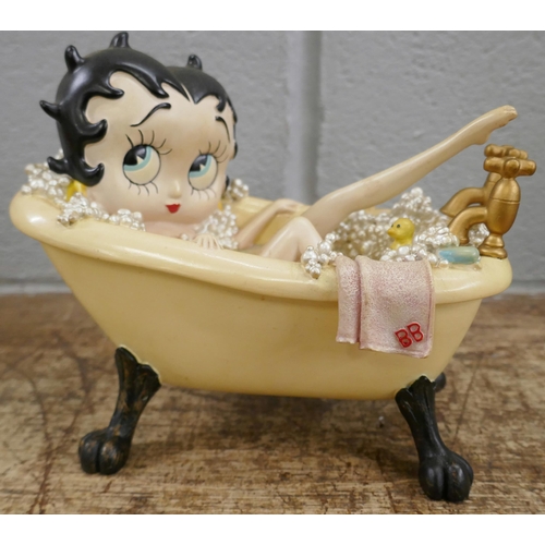 822 - Six Betty Boop resin figures including one in lemon yellow glitter dress, one in bathtub, one seated... 