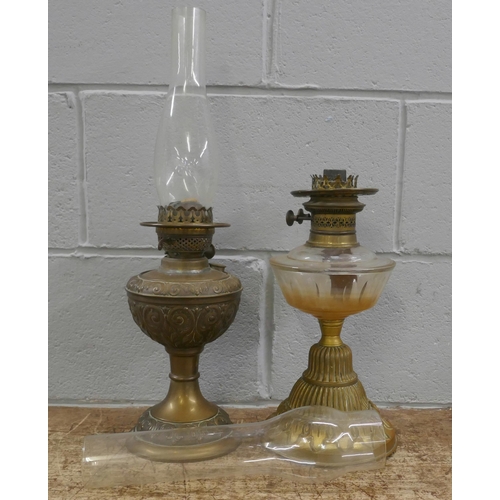 833 - Two oil lamps **PLEASE NOTE THIS LOT IS NOT ELIGIBLE FOR POSTING AND PACKING**