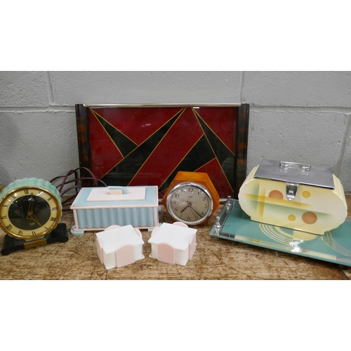 834 - Art Deco items, two drinks trays, biscuit barrel, two clocks, one in phenolic butterscotch and three... 