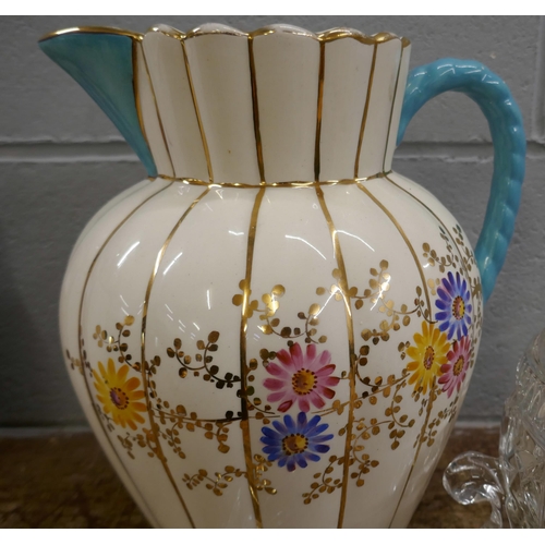 836 - A large early 20th Century jug with floral detail, a glass bowl and two pairs of salad servers