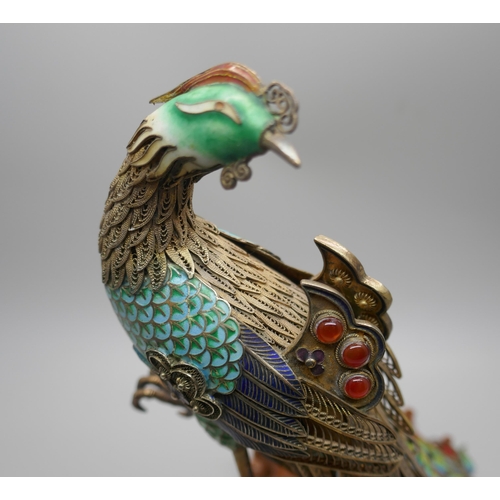 848 - A Chinese silver gilt and enamelled model of a peacock, one amber enamelled piece missing, affixed t... 