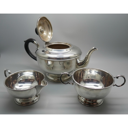 854 - A three piece silver tea service, Birmingham 1958, 627g