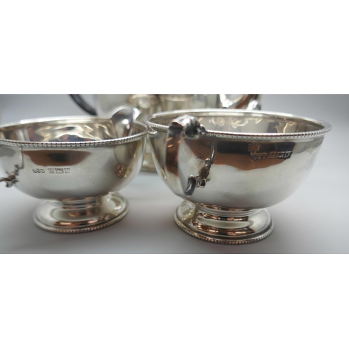 854 - A three piece silver tea service, Birmingham 1958, 627g