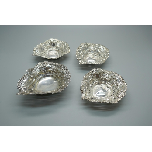 871 - Four pierced silver and embossed dishes, Birmingham 1895/98, 51g, (3+1)