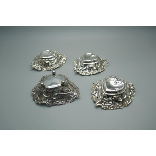 871 - Four pierced silver and embossed dishes, Birmingham 1895/98, 51g, (3+1)