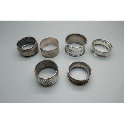 875 - Six silver napkin rings including two Victorian, 104g