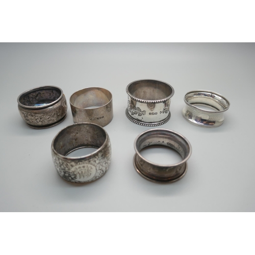 875 - Six silver napkin rings including two Victorian, 104g