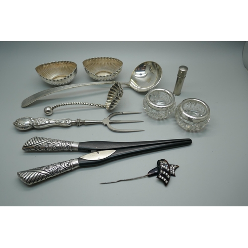 884 - A pair of Victorian silver mounted glove stretchers, a toasting fork with silver handle, a pair of s... 