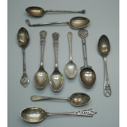 886 - Ten silver golfing spoons, 134g