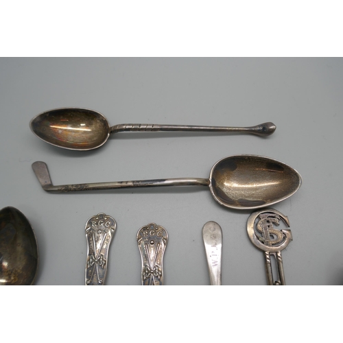 886 - Ten silver golfing spoons, 134g