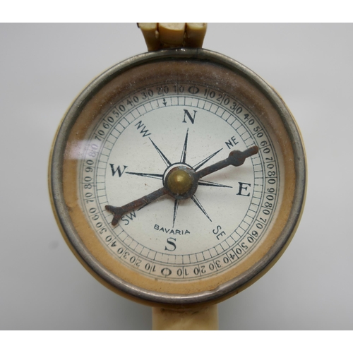 891 - An antique travelling compass, marked Bavaria, a/f, lens frame requires repair