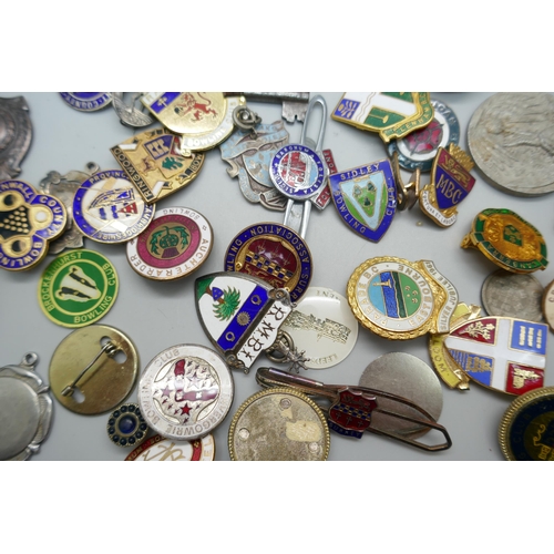 899 - Two silver and enamelled fob medals, one other silver fob medal, an Austrian pin with athlete marked... 