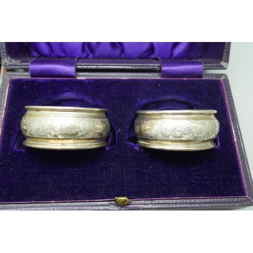 906 - Two small circular silver dishes, two boxed silver napkin rings, boxed set of six silver handled kni... 