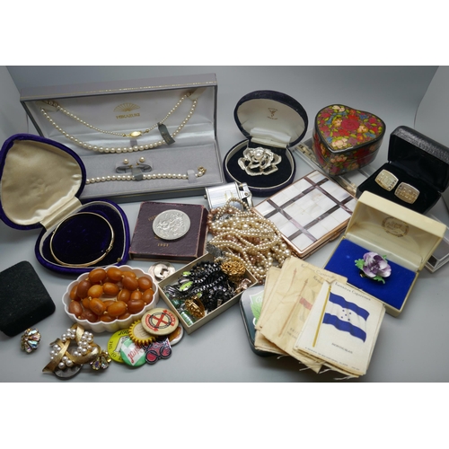 940 - A collection of costume jewellery, badges, etc.