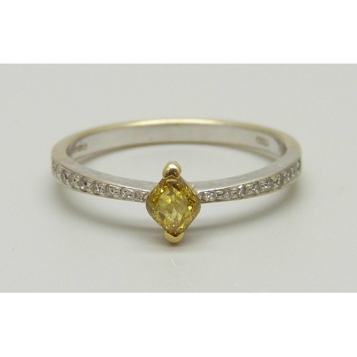 967 - An 18ct gold ring set with a yellow diamond and diamond shoulders, 1.8g, N