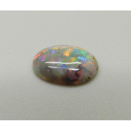 969 - A collection of unmounted stones including black opal, a pair of pink tourmaline, jade, ruby, sapphi... 